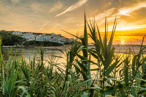 Small village at Praia Odeceixe on the west coast in Portugal at sunset photo