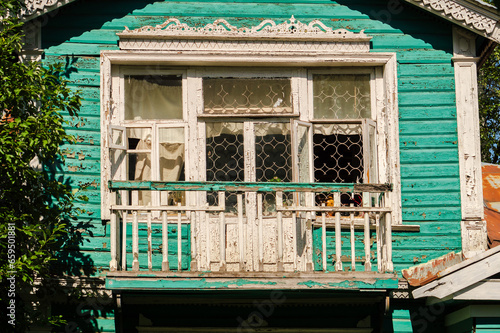 An old Russian wooden house with carved platbands