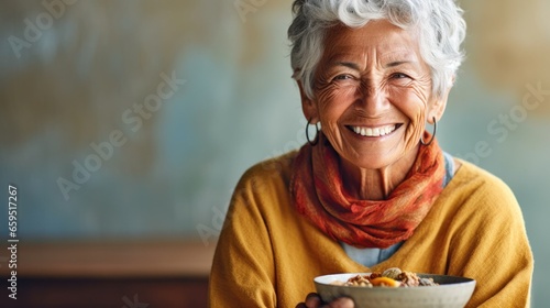 Smiling senior delighting in nourishing breakfast bowl. photo