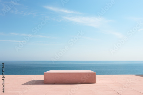 Abstract minimalist podium stage with square pedestals for product presentation against blue sky background and seas © pundapanda