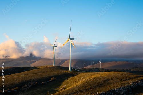A wind farm or wind park, is a group of wind turbines used to produce electricity. This particular wind farm is located on the mountains of Italy and it allows to realize clean energy. enviromental