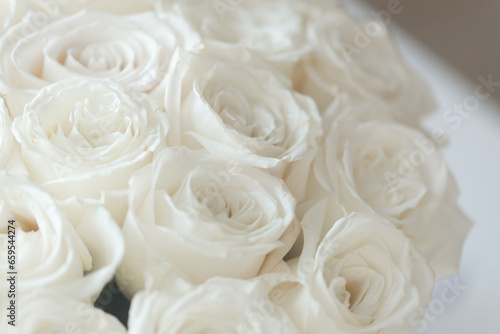 White roses Flower Arrangement in a glass vase