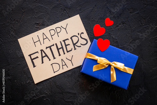 Happy Fathers day greeting card with blue gift box, top view