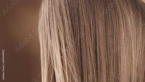 Wallpaper Mural Close-up shot of a beautiful young woman hair. She is standing sideways with her head up, the wind blowing on her and developing her hair. She lowers her head slightly, looks at the camera and smiles Torontodigital.ca