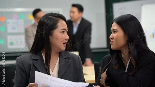 group of asian office worker woman talking or whispering gossip with colleague rumors to coworker in office