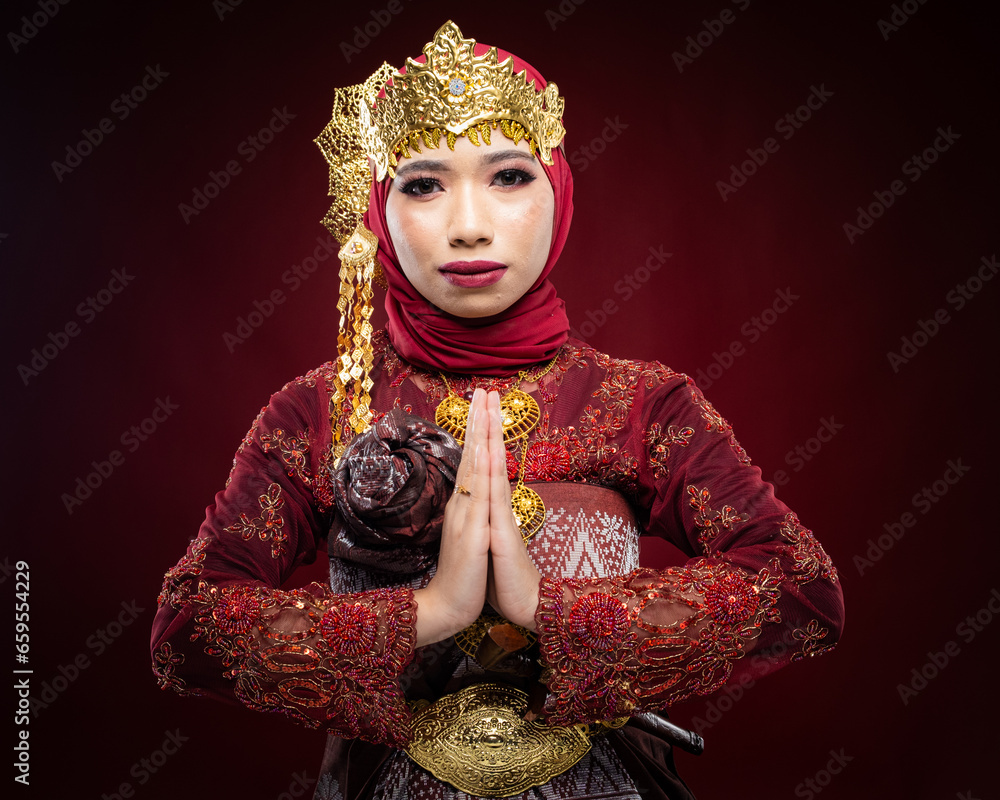 An Asian female traditional damcer wearing a traditional apparel and accessories dancing the traditional dance