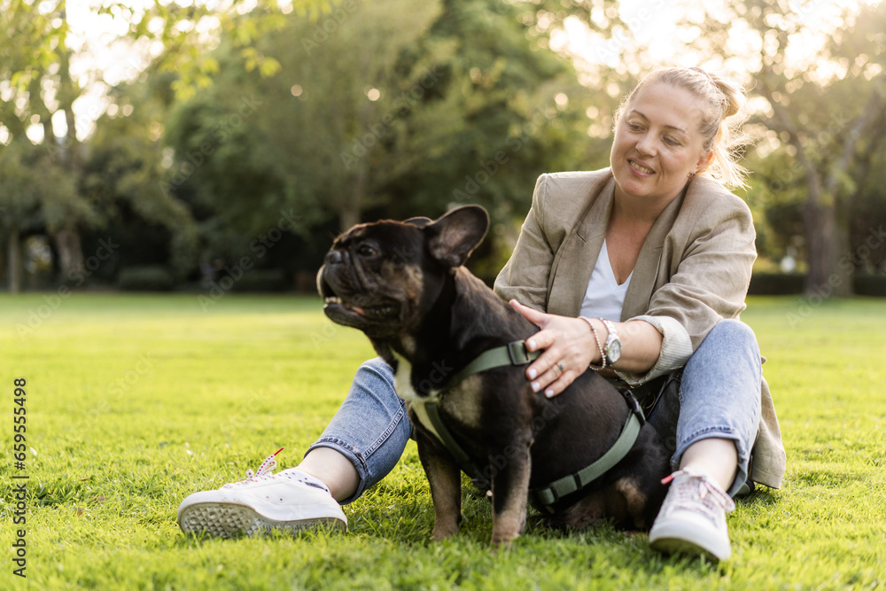 Blonde girl of forty years old cuddles with her dog Blonde girl of forty years old cuddles with her dog