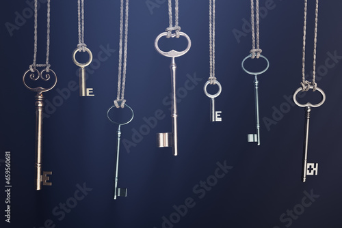 A collection of various keys hanging on a twine, making rustic and vintage vibe