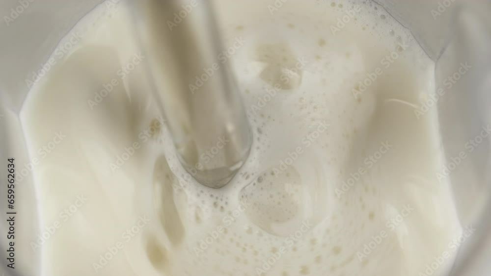 Pouring water into glass with protein powder. Making protein cocktail