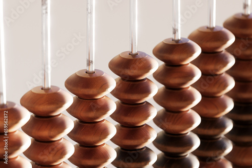 Obraz na płótnie A vintage wooden abacus with beads and metal wire, perfect for counting w salonie