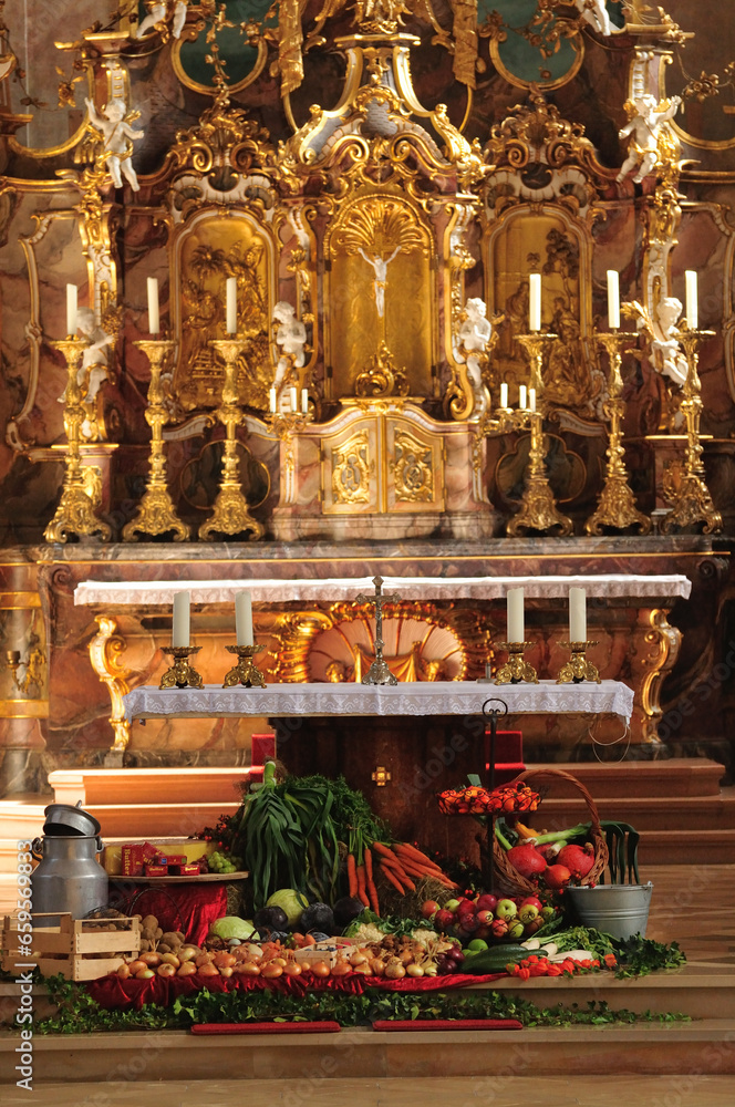 European catholic church with fruits and vegetables in autumn