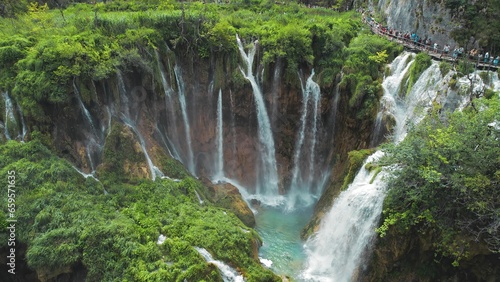 Plitvice Lakes National Park with many waterfalls. Clean water flows from cliffs in cascades. Nature in Croatia.