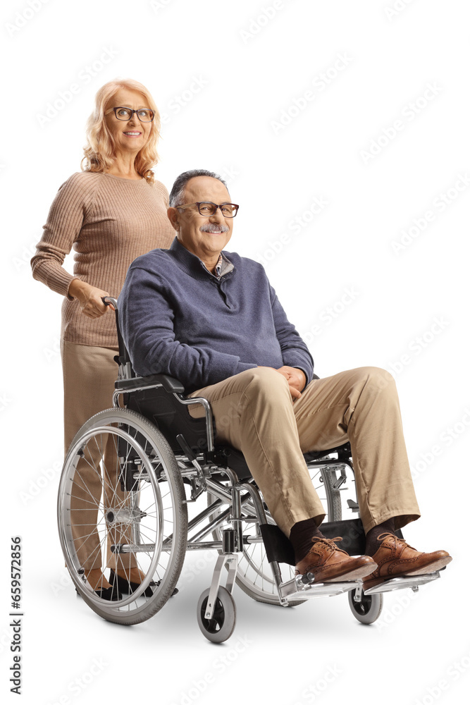 Wife standing behind a husband in a wheelchair Wife standing behind a husband in a wheelchair