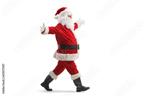 Full length profile shot of santa claus walking with arms wide open