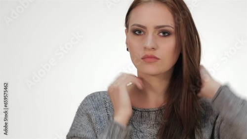 Trendy long haired young model posing