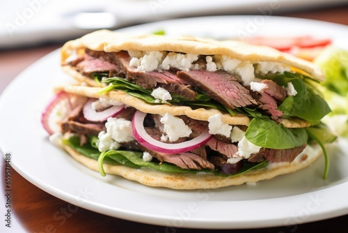 close-up of a gyro sandwich on a white plate