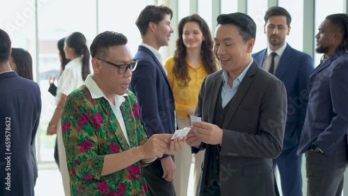 group of diversity business people shaking hands and greeting each other Exchanging Business Cards after a meeting conference or seminar. Communication in Corporate at office. connecting people. asian photo