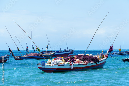 traditional dhow fishing boats moored at high tide