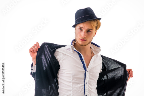 A man with a hat and a jacket on. Photo of a stylish man wearing a hat and jacket with a cool and confident demeanor