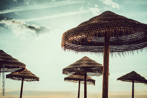 Parasols on the beach at sunrise