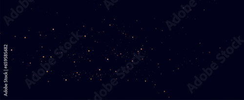 Golden sequins glow with many lights. Glittering dust. Luxurious background of golden particles.	