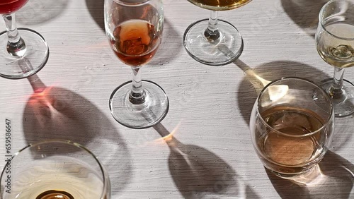 Glasses with different wine types on the table, wine tasting, party and celebration concept.
