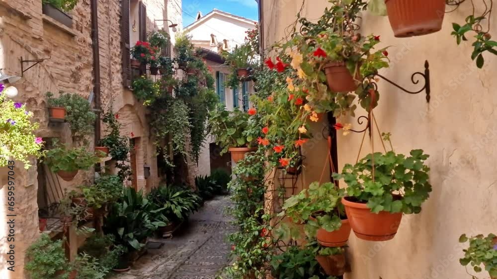 Traditional old villages of Italy, Umbria - Spello town. Charming floral streets decoration Traditional old villages of Italy, Umbria - Spello town. Charming floral streets decoration