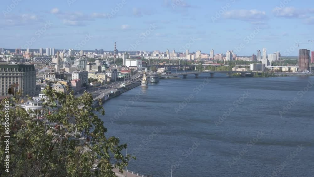 Aerial landscape view of Kyiv. Podil neighborhood. River Dnipro with several bridges at the background. Windy autumn day in Kyiv. Travel and tourism concept Aerial landscape view of Kyiv. Podil neighborhood. River Dnipro with several bridges at the background. Windy autumn day in Kyiv. Travel and tourism concept