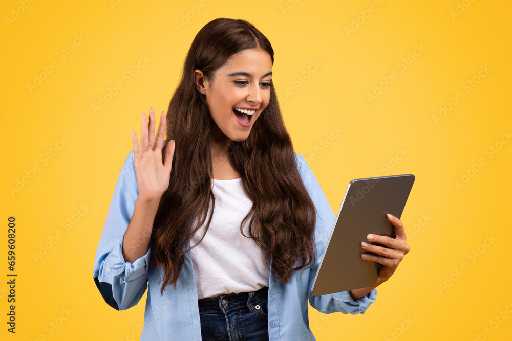 Smiling pretty european woman student, use tablet, waving hand Smiling pretty european woman student, use tablet, waving hand