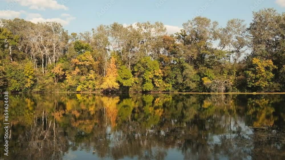 Autumn landscape. View of the river and forest in autumn at sunset. Autumn landscape. View of the river and forest in autumn at sunset.