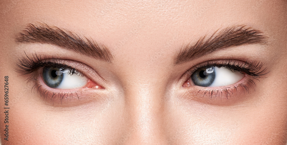 Beautiful female eyes with long eyelashes. Eyelash extensions. Makeup, cosmetics, beauty. Close up, macro Beautiful female eyes with long eyelashes. Eyelash extensions. Makeup, cosmetics, beauty. Close up, macro