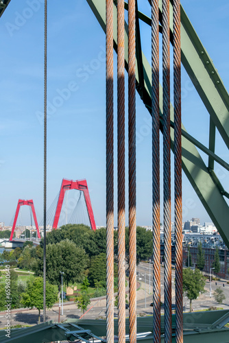 Rotterdam, the Netherlands-September 10, 2023; Old railroad tracks of vertical-lift rail bridge De Hef (the lift) officially Koningshaven Bridge over Koningshaven (Kings Harbor) channel photo