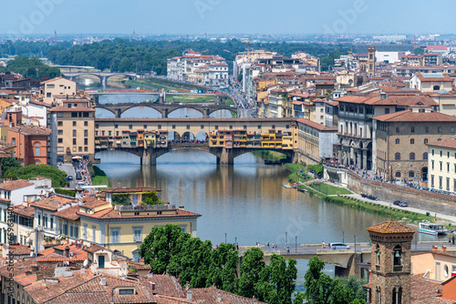 View over length of Arno River in Florence, Italy with a number of bridges crossing the river including Ponte Vecchio, Ponte Santa Trinita, Ponte alle Grazie and Ponte alla Carraia photo