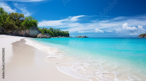 A secluded beach with azure waters meeting pristine white sands.
