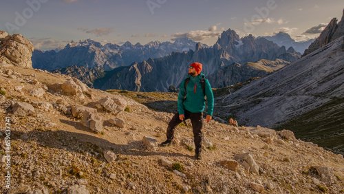 Amidst the rugged grandeur of the mountains, a lone adventurer embarks on a journey of discovery.