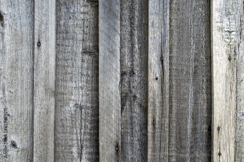 Close-up view of old wooden plank. Grey boards. Aged wood texture. Wooden background.
