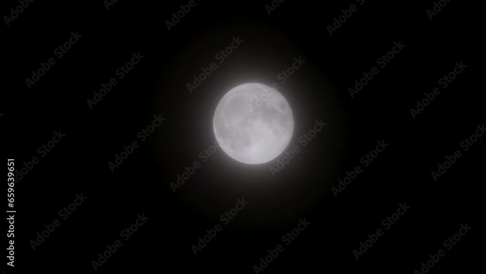bright full moon being covered by clouds bright full moon being covered by clouds