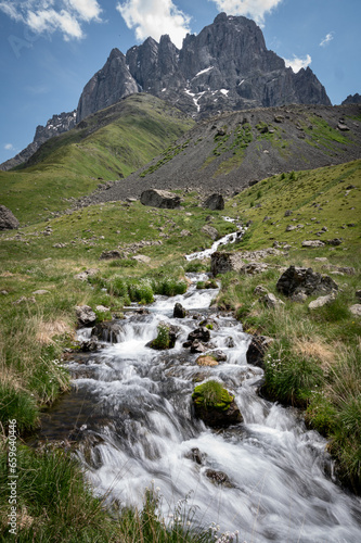 A view of stream of water flowing down Juta Canyon from the snow mountains