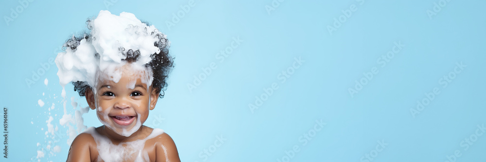 banner copyspace Little smiling african American baby boy with big soap foam on head in hair. on solid blue background, Kids hygiene, Shampoo, hair treatment and soap for children, child bathing time - obrazy, fototapety, plakaty 