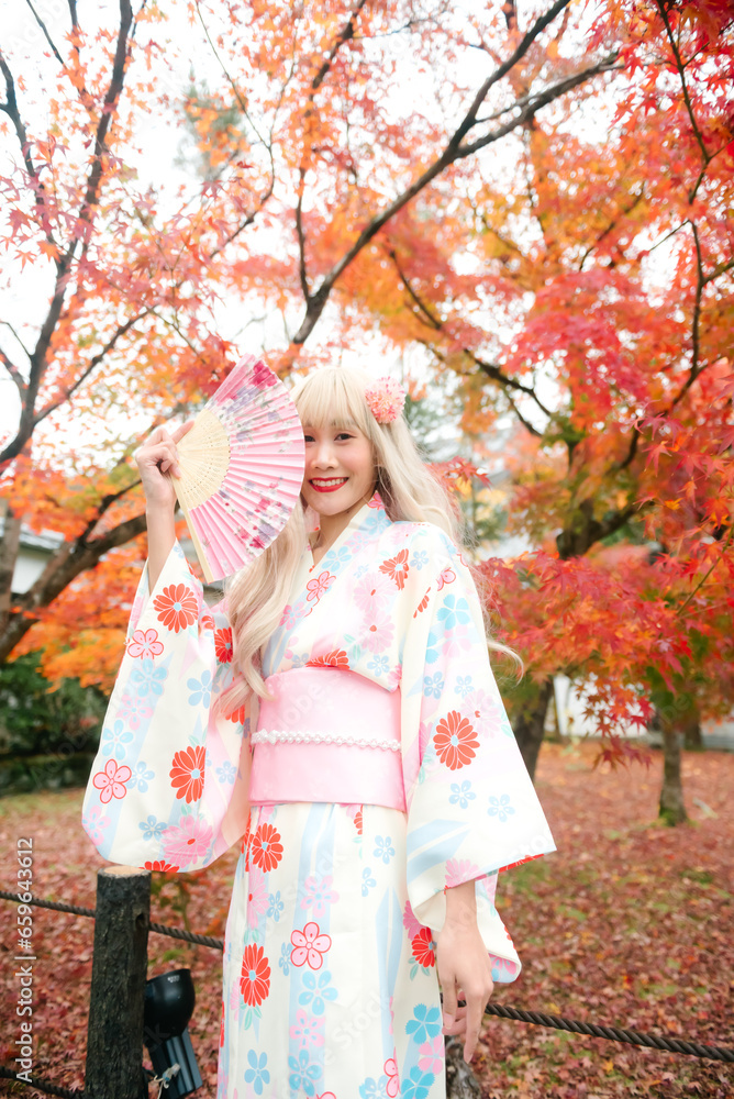 Asian woman wearing kimono in autumn. Japan autumn. Asian woman wearing kimono in autumn. Japan autumn.