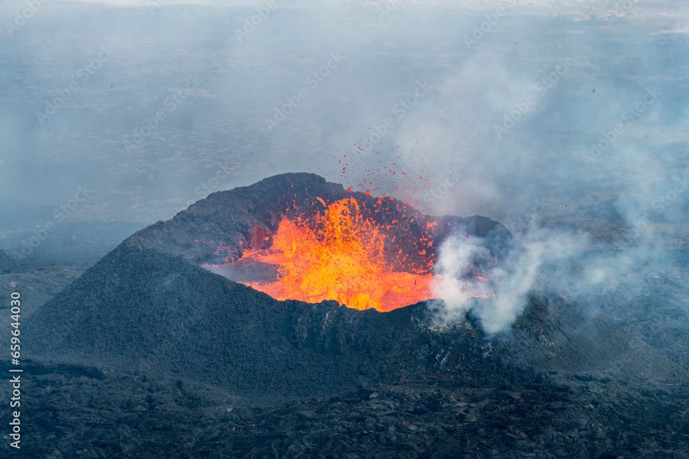 Close up view of spatter cone with lava of fissure near Litli-Hrútur Hill during the 2023 eruption near the mountain Fagradalsfjall, Iceland volcano area - obrazy, fototapety, plakaty 