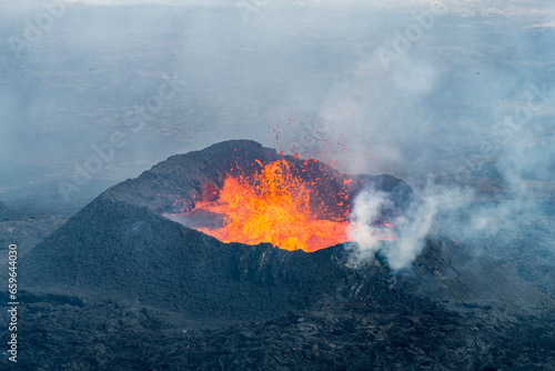 Close up view of spatter cone with lava of fissure near Litli-Hrútur Hill during the 2023 eruption near the mountain Fagradalsfjall, Iceland volcano area