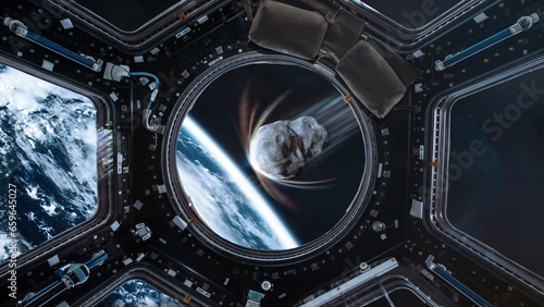 Fototapeta Naklejka Na Ścianę i Meble -  Planet Earth and big asteroid in spaceship porthole in outer space. Meteorite in outer space near Earth planet. Elements of this image furnished by NASA.