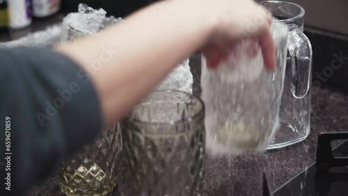 Organizing glass cups in the kitchen with a glass jar. Removing bubble wrap from glass cups
