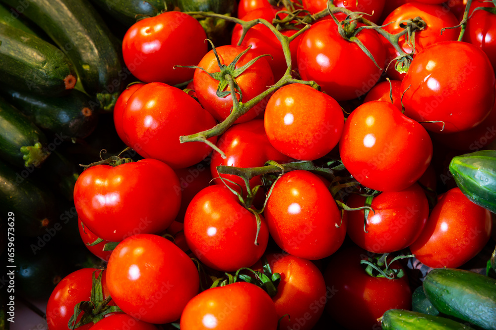 Harvest of ripe fresh tomatoes, displayed for sale in the store on the counter