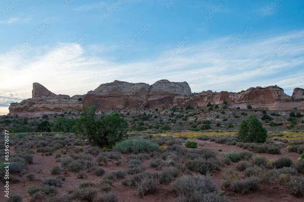 SunSet at Canyonlands national park in Utah; the warm golden light illuminates the rock formations. 
