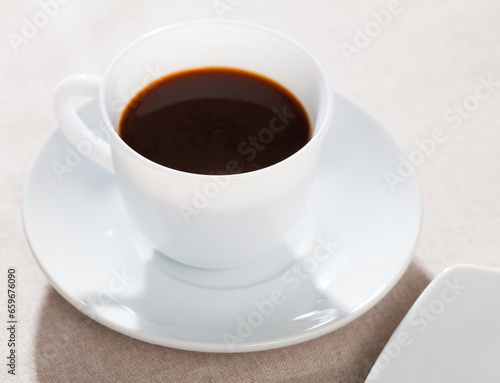 Image of cup of fresh black coffee americano on table, no people