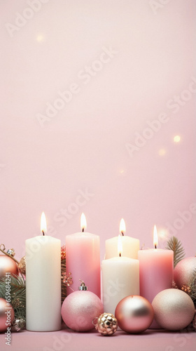 Christmas candles on pink background.