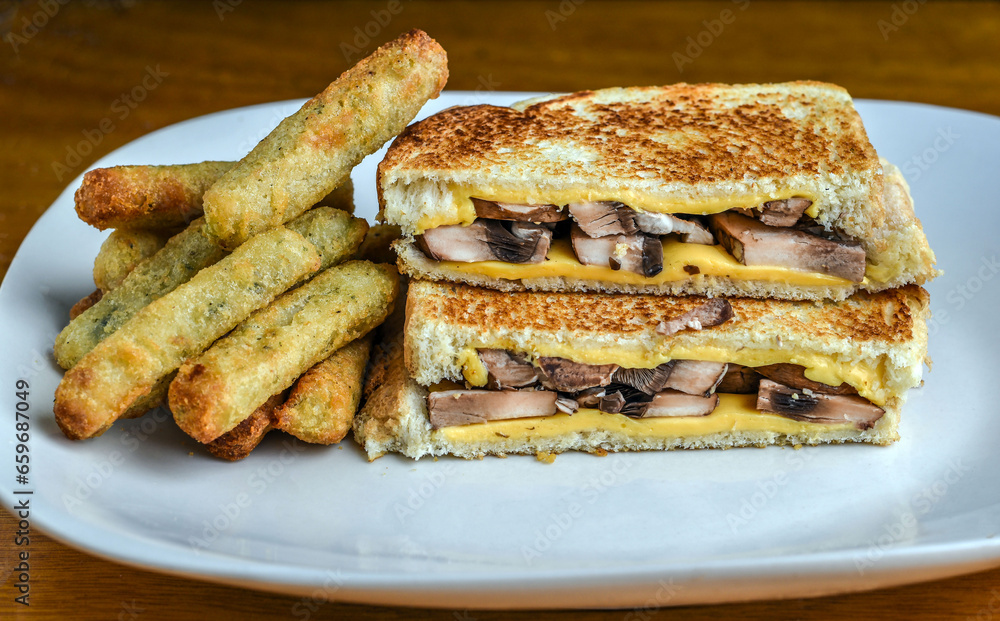 mushroom melt sandwich served with broccoli fries mushroom melt sandwich served with broccoli fries