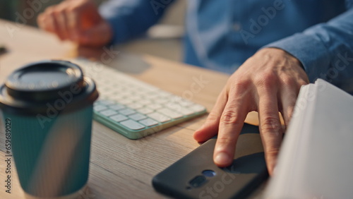 Businessman hands answering telephone call cabinet closeup. Man picking up phone